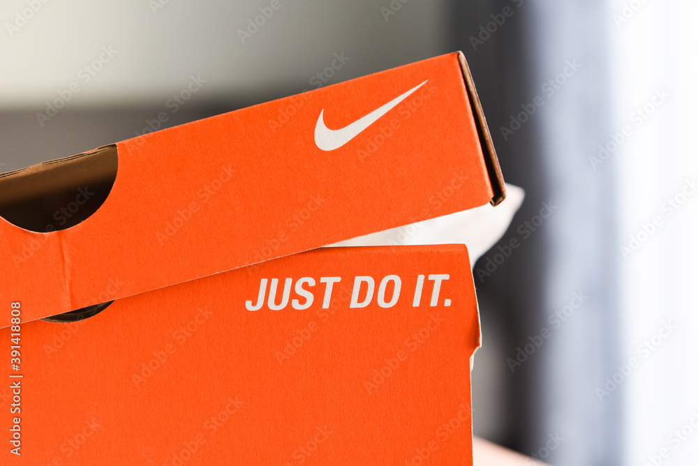 Nike running shoes box with Just Do It and nike logo on orange box in the  store Stock Photo | Adobe Stock