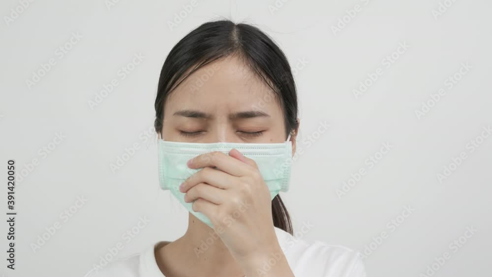 Asian women wear masks to protect disease on white background. Asian women wear masks to protect disease on white background.
