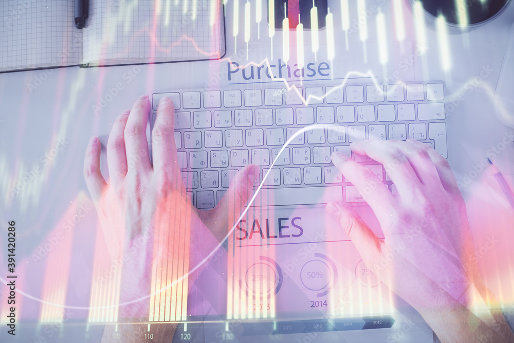 Double exposure of man's hands typing over laptop keyboard and forex chart hologram drawing. Top view. Financial markets concept. Double exposure of man's hands typing over laptop keyboard and forex chart hologram drawing. Top view. Financial markets concept.