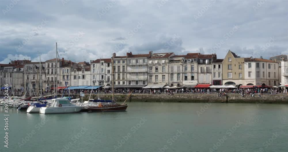 La Rochelle,Charente Maritime department, Region Nouvelle Aquitaine, France. View of the old harbour. On the left side is the Grosse Horloge tower. La Rochelle,Charente Maritime department, Region Nouvelle Aquitaine, France. View of the old harbour. On the left side is the Grosse Horloge tower.