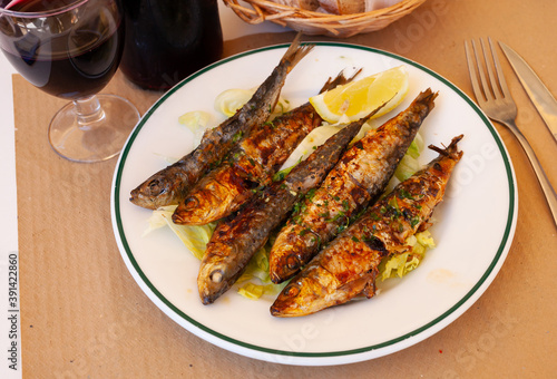 Beer snack - fried sardines with lemon and parsley