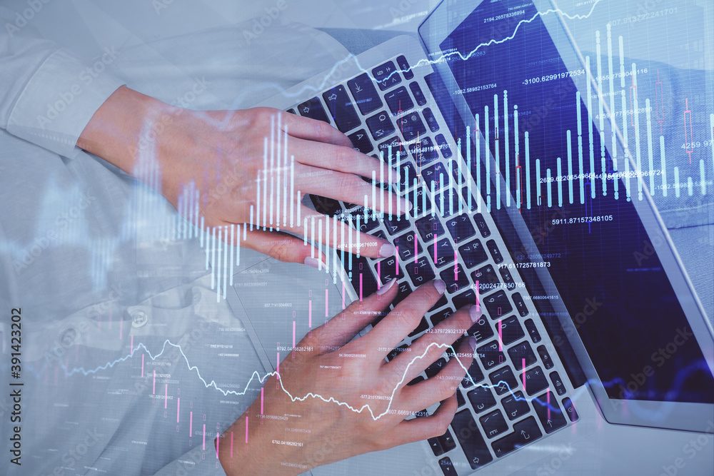 Double exposure of woman hands working on computer and forex chart hologram drawing. Top View. Financial analysis concept. Double exposure of woman hands working on computer and forex chart hologram drawing. Top View. Financial analysis concept.