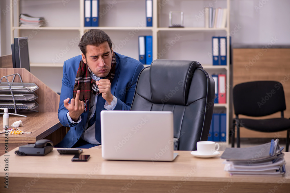 Young sick businessman employee suffering at workplace Young sick businessman employee suffering at workplace
