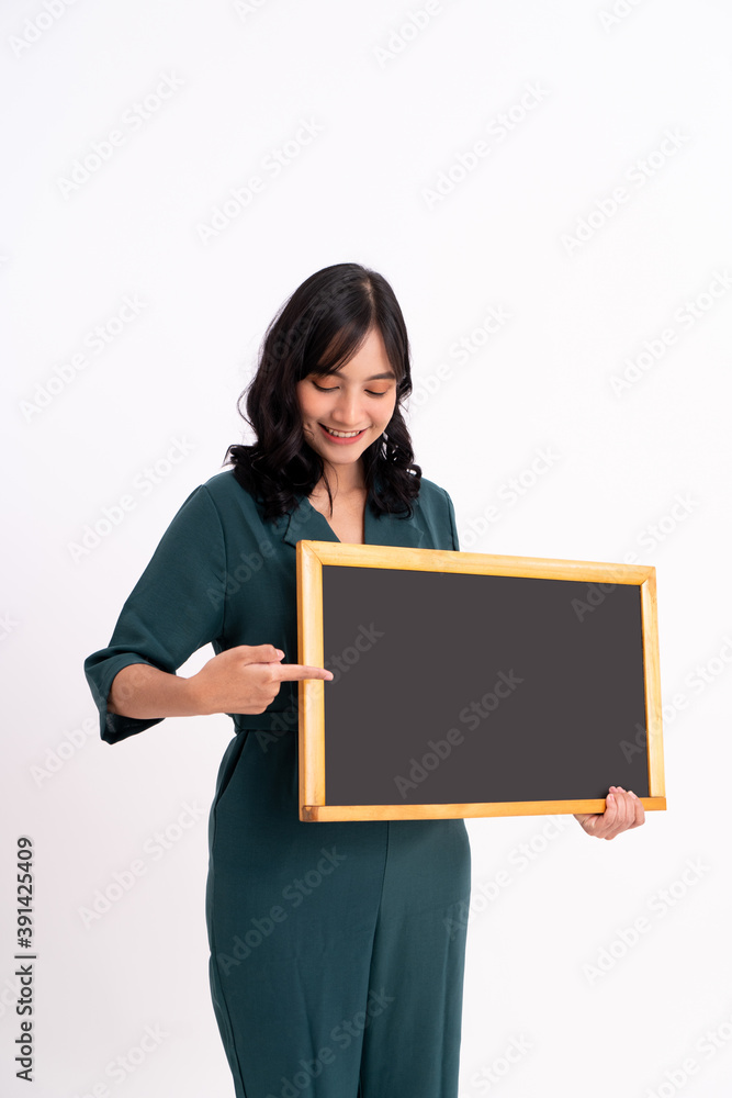 Happy business woman portrait. Showing copy space on the board Happy business woman portrait. Showing copy space on the board