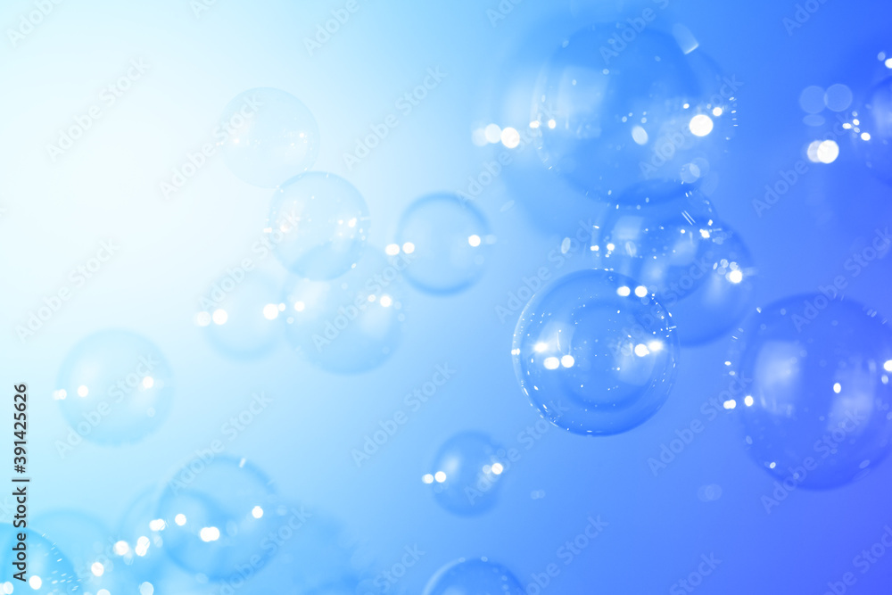 Blue soap bubbles float background. natural fresh, bubbly shiny clear texture background. Blue soap bubbles float background. natural fresh, bubbly shiny clear texture background.