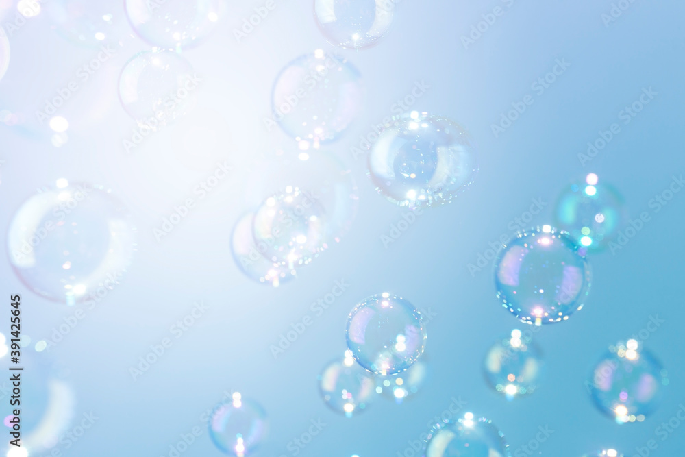 Beautiful shiny blue soap bubbles texture background. Abstract, Natural fresh soapy summer background.