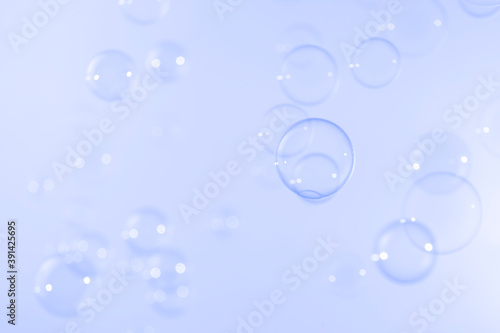 Transparent clear soap bubbles float on blue background. Abstract, Natual fresh summer a blue texture.