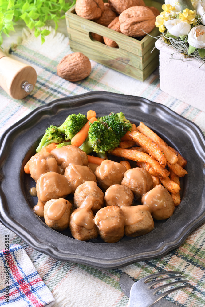 Chicken meatballs in creamy sauce on a plate Chicken meatballs in creamy sauce on a plate