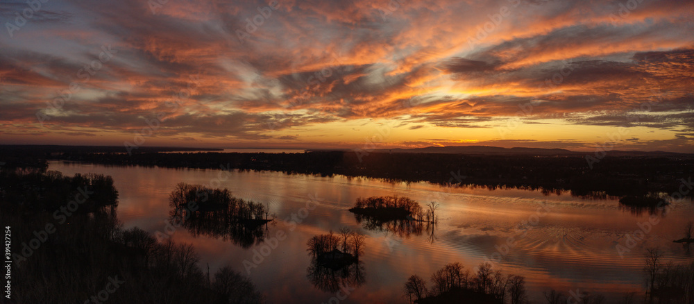 Panoramic aerial view of a dramatic sunset over the river in Laval, Quebec