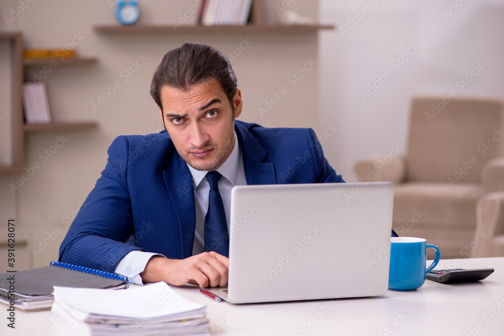 Young male employee working from home in pandemic concept Young male employee working from home in pandemic concept
