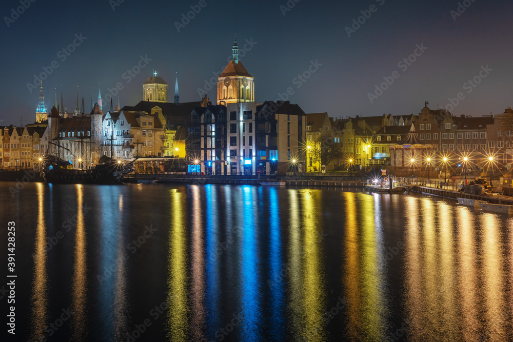 Wonderful night view of Gdansk with reflection of houses in the water