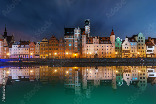 Wonderful night view of Gdansk with reflection of houses in the water