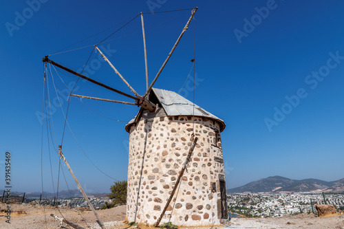 Old windmill in sunny day, Bodrum, Turkey. 
