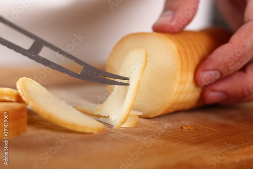 Slicing smoked cheese