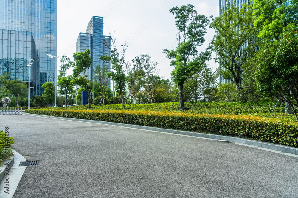 clean asphalt road through office block area, suzhou, china clean asphalt road through office block area, suzhou, china