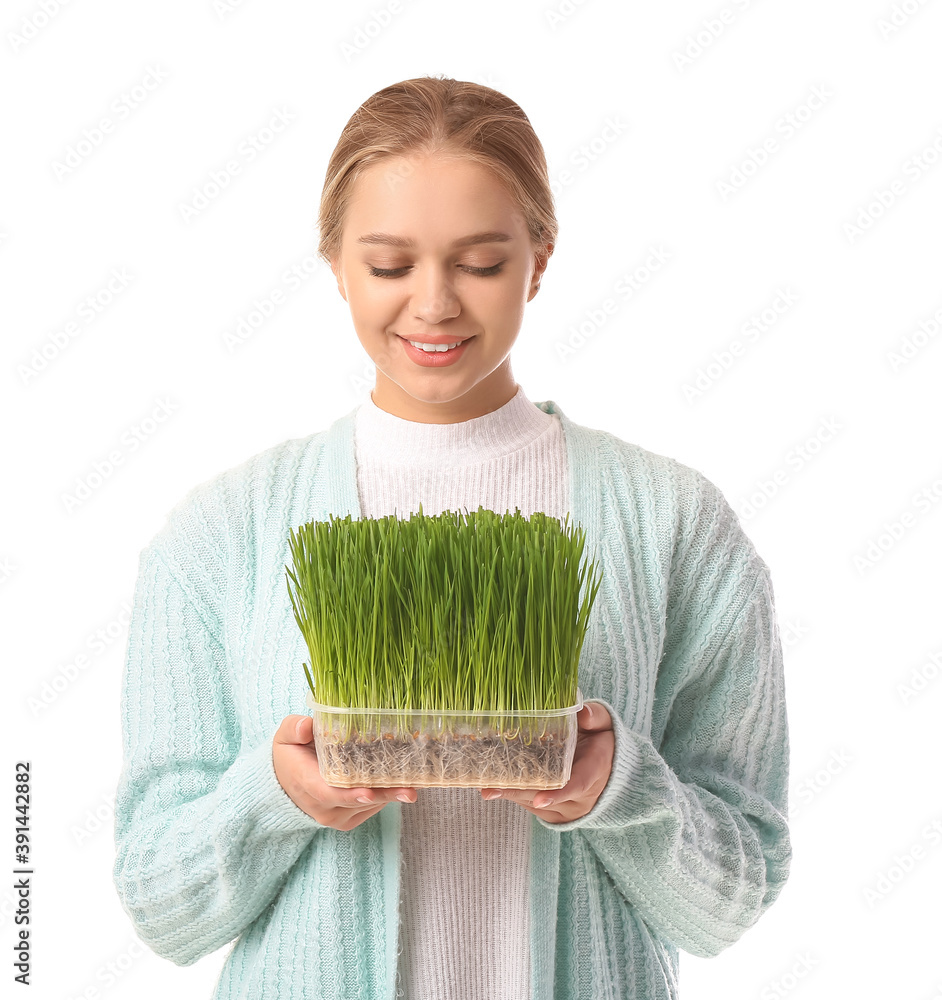 Young woman with wheatgrass on white background Young woman with wheatgrass on white background