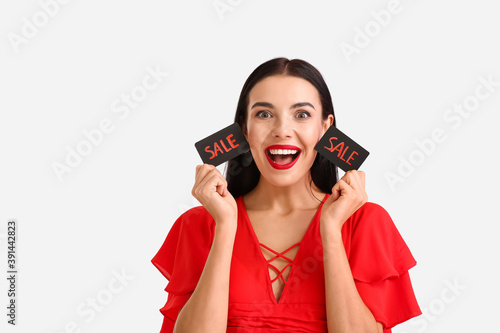 Happy young woman with cred...