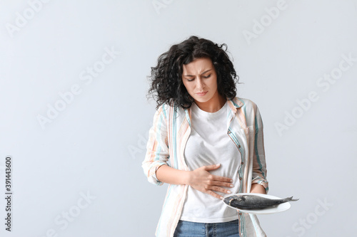Young woman with food aller...