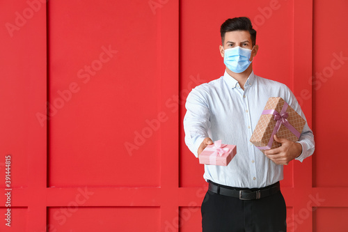 Young man in medical mask a...