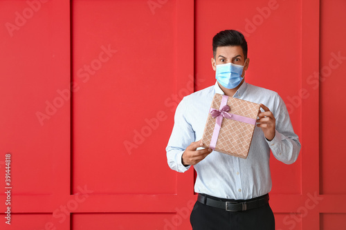 Young man in medical mask a...