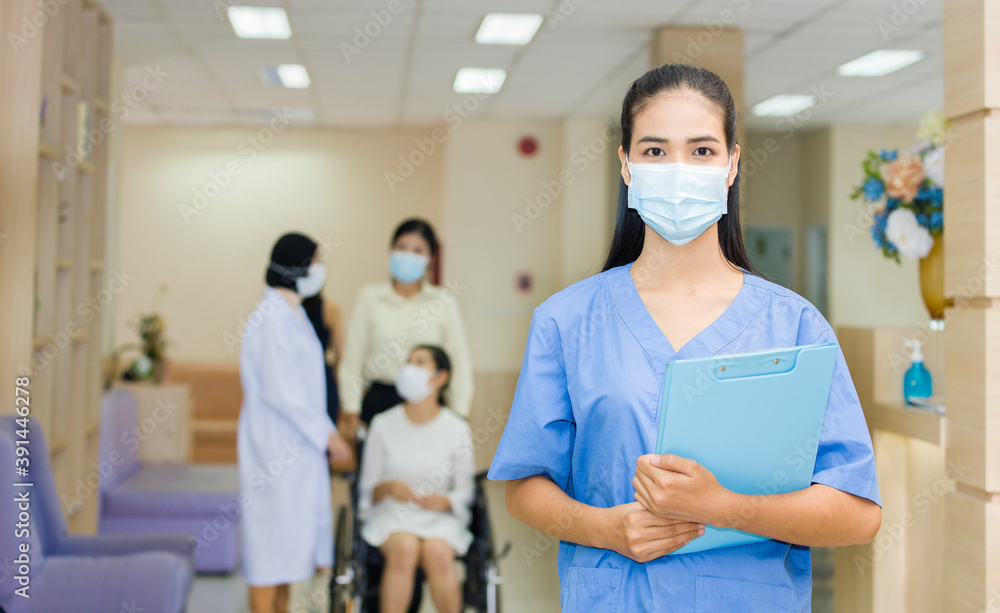 Asian woman doctor wearing a mask holding a file in the hospital. Asian woman doctor wearing a mask holding a file in the hospital.
