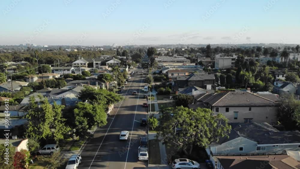 Aerial slow flyover over streets with traffic, houses, and trees, Los Angeles suburbs, in California, USA, sunny day - dolly, drone shot Aerial slow flyover over streets with traffic, houses, and trees, Los Angeles suburbs, in California, USA, sunny day - dolly, drone shot