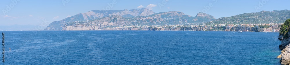 Panorama of the Amalfi Coast with Sorrento cliffs and mountains and the Mediterranean Sea, from Regina Giovanna beach in the Gulf of Naples, Campany, Italy