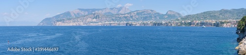 Panorama of the Amalfi Coast with Sorrento cliffs and mountains and the Mediterranean Sea, from Regina Giovanna beach in the Gulf of Naples, Campany, Italy photo