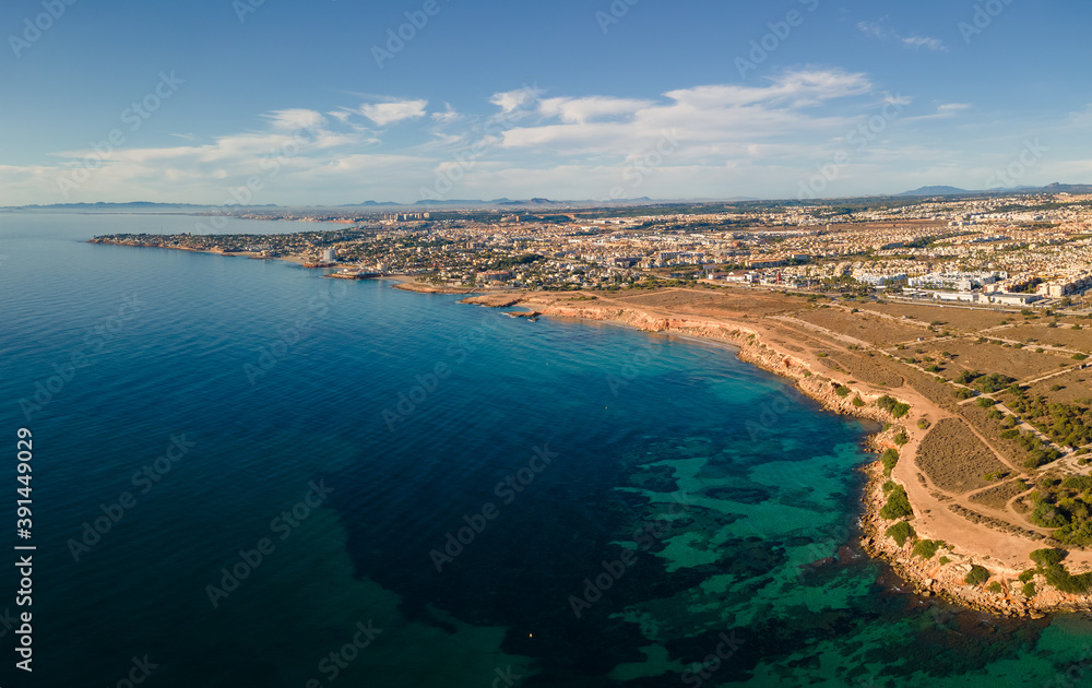 The east coast of Spain near Orihuela photographed from the air in autumn in sunshine. There is little wind. That's why you can see the sea floor.