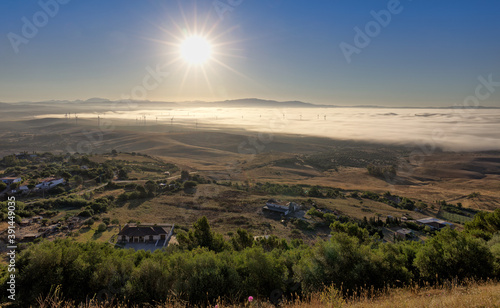 A view from above of the clouds. A beautiful morning mood in Andalusia in Spain. The sun has risen and illuminates the rural area east of the city of Medina-Sidonia.