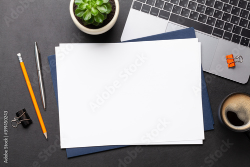 Office workplace table with blank paper page