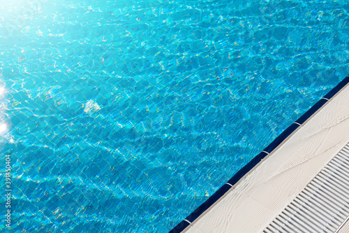 Sunny swimming pool in tropical resort © karandaev