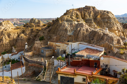 View of spanish city Guadix with famous troglodyte houses carved in tuff rocks