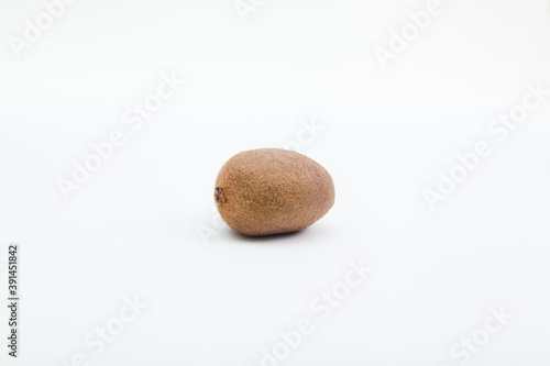 whole kiwi on white background