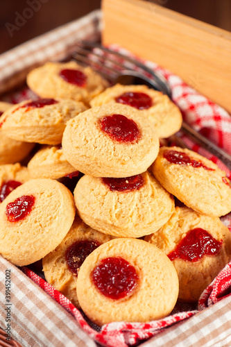 Delicious fresh baked jam drop biscuits, food background.