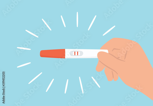 Hand is holding a pregnancy test with positive result as a two lines. Planning a baby, motherhood and healthcare concept. Flat vector illustration photo