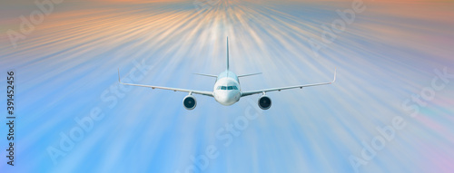 Airplane with motion blur effect at sunset