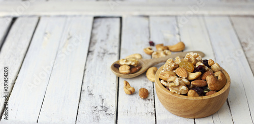 Bowl of mixed nut for healthy life on wwoden table