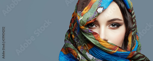 beautiful woman in color veil. beauty girl in colorful hijab photo