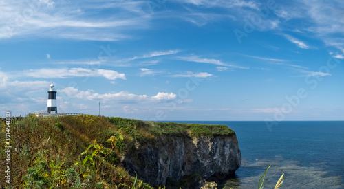 Panoramic view of lighthouse at Cape Notoro with clear blue sky