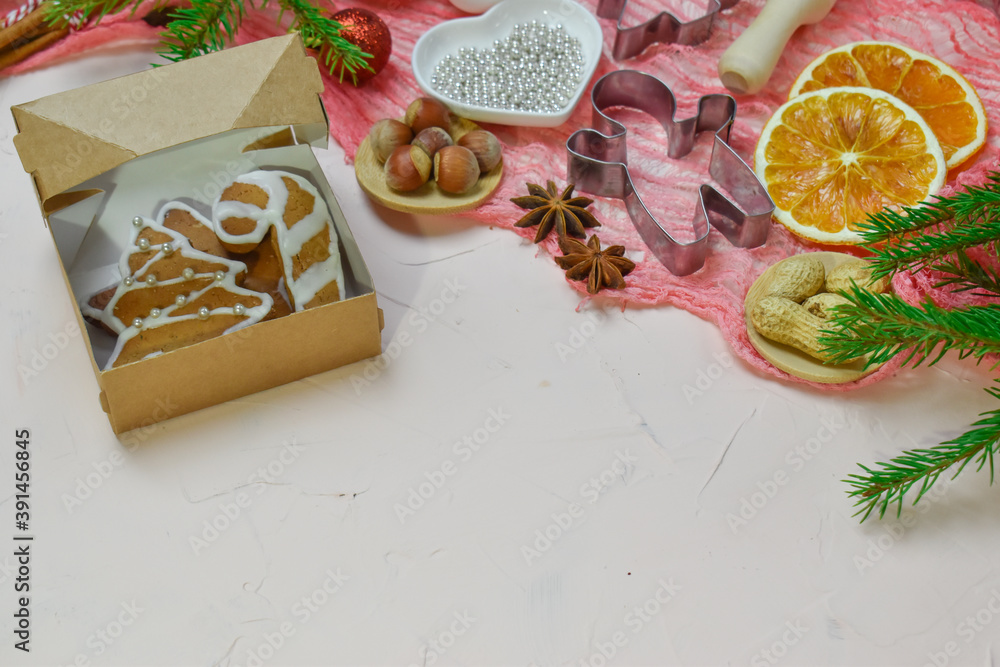 Christmas background with cooking ingredients and ready-made glazed cookies. Copy of the space
