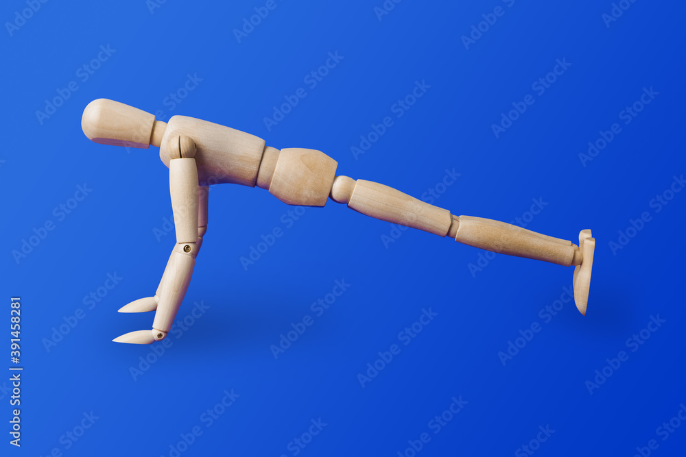 Sports wooden toy figure on blue Sports wooden toy figure on blue
