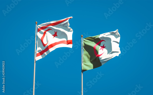 Beautiful national state flags of Turkish Republic of Northern Cyprus and Algeria together at the sky background. 3D artwork concept.