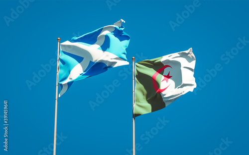 Beautiful national state flags of Scotland and Algeria together at the sky background. 3D artwork concept.