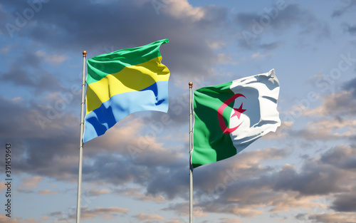 Beautiful national state flags of Gabon and Algeria together at the sky background. 3D artwork concept.