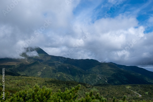 View of cloudy mountain ranges by Lake Rausu