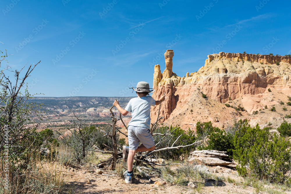 young boy looking at Chimney Rock, through a protected canyon landscape young boy looking at Chimney Rock, through a protected canyon landscape