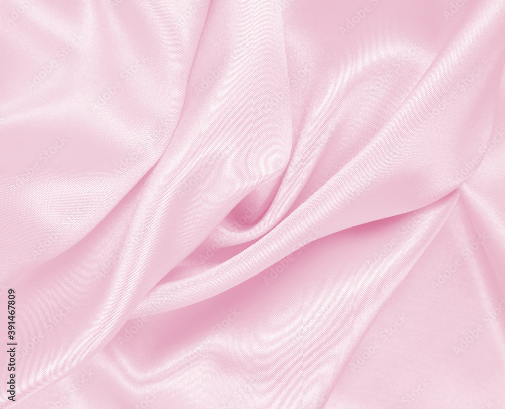 Obraz premium Smooth elegant pink silk or satin texture as wedding background. Luxurious background design