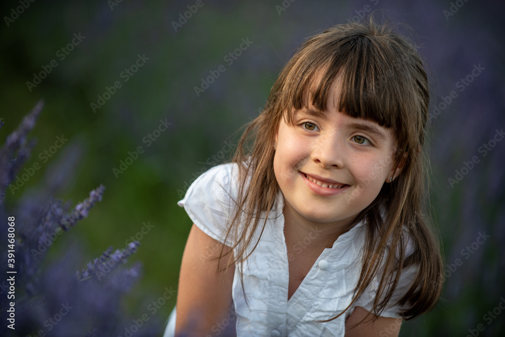 Beautiful little girl in a lavender field in Italy Beautiful little girl in a lavender field in Italy