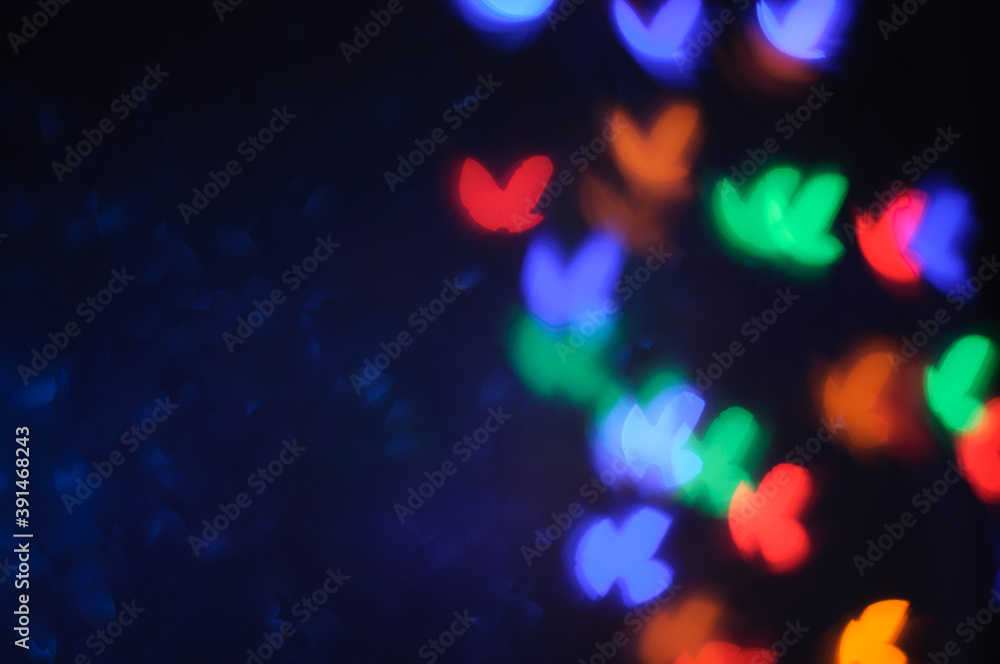 Red, blue, green, yellow bokeh on dark background, stock photo, defocused light on black background, bokeh in the form of birds or butterflies Red, blue, green, yellow bokeh on dark background, stock photo, defocused light on black background, bokeh in the form of birds or butterflies